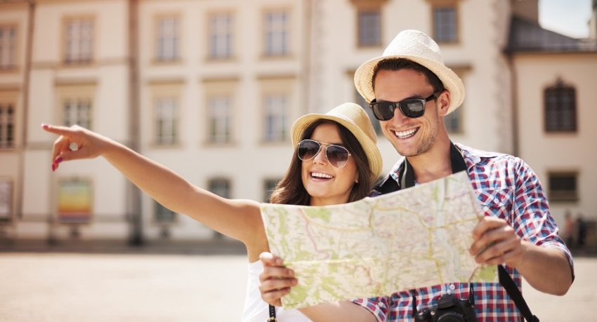 Tourists sightseeing in a European city using a paper map