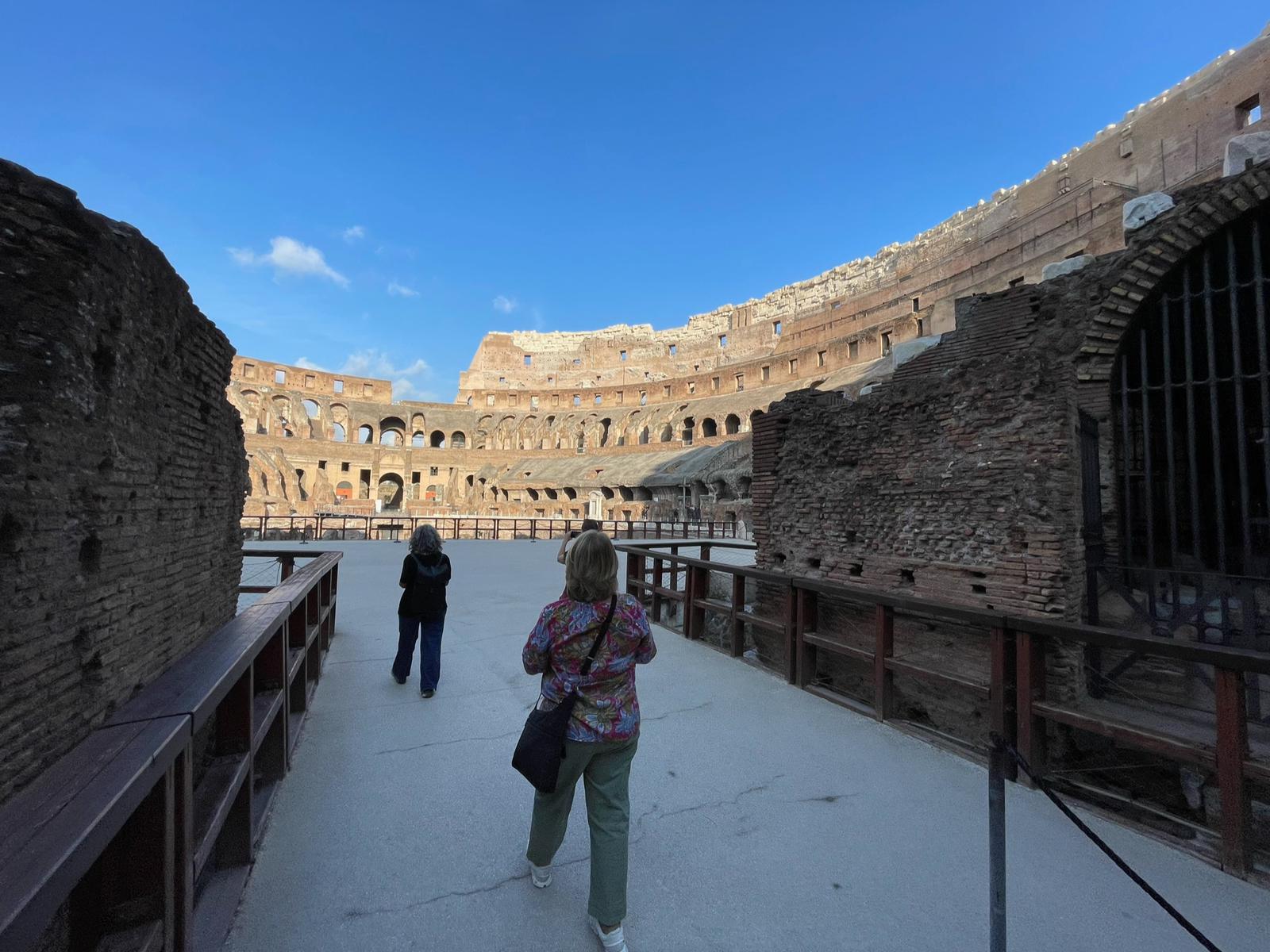 Walking inside the Colosseum with views of the arena