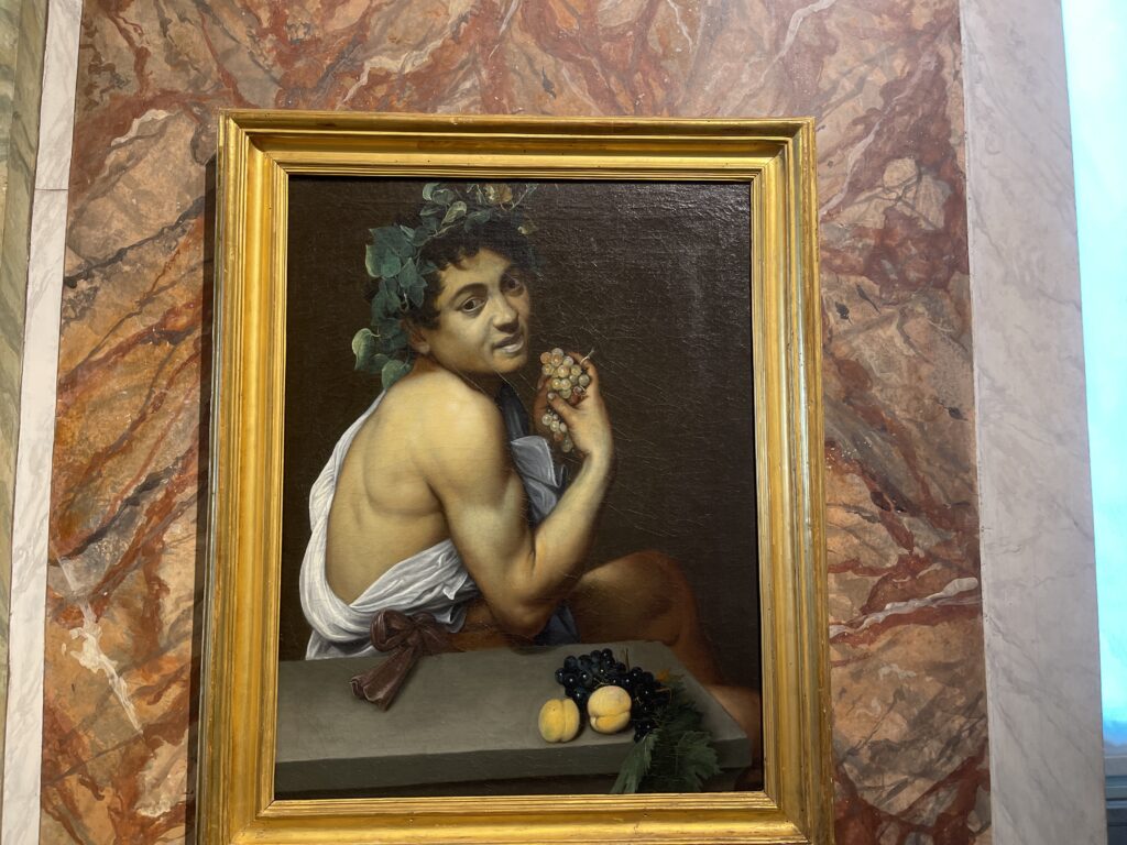 boy eating fruit by caravaggio in the gallery borghese