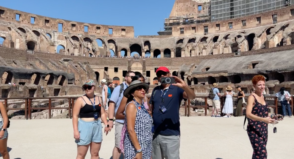 couple taking a selfie on the arena of the colosseum