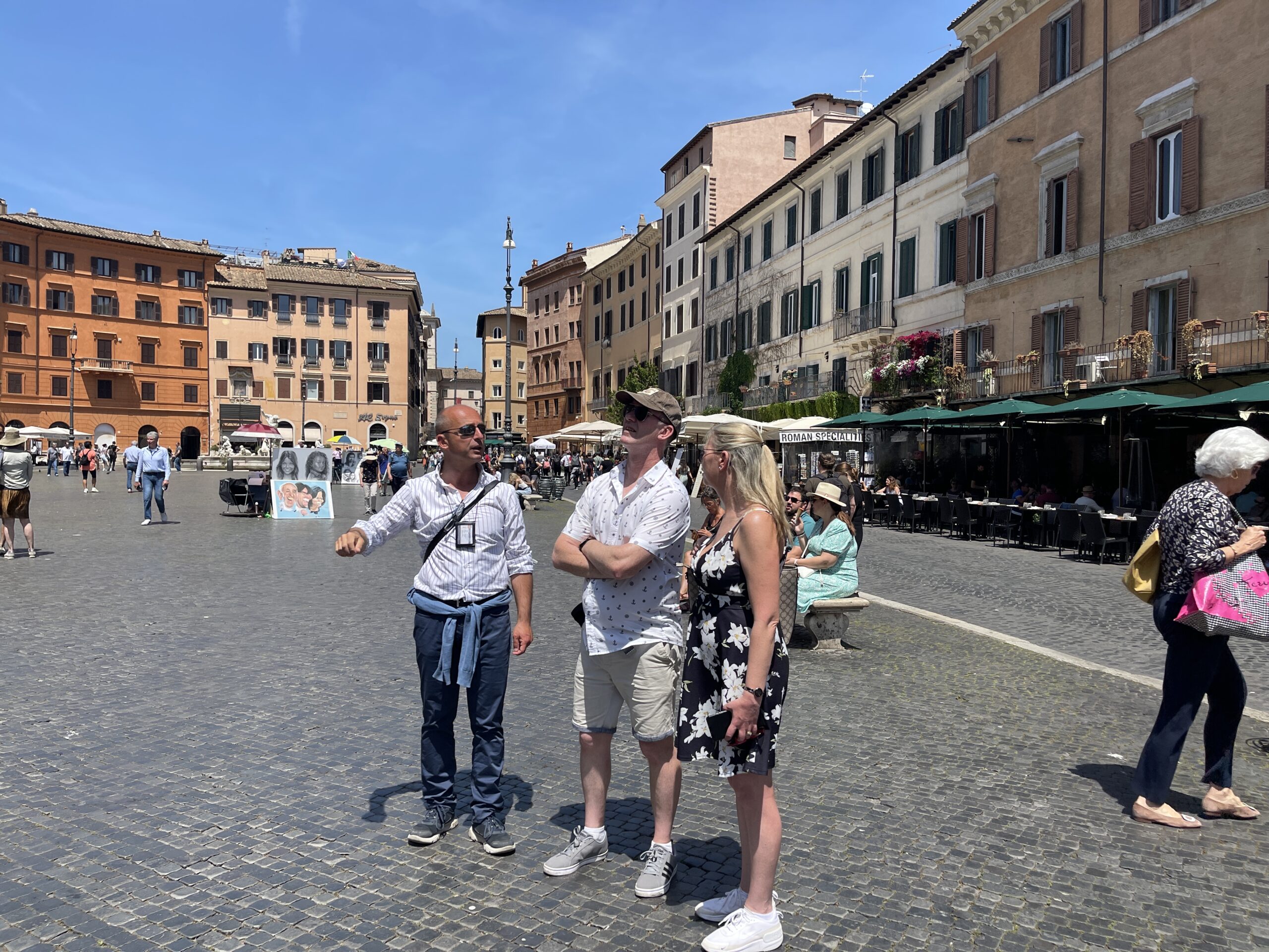 tour guide of rome, max, at piazza navona with a couple on the real rome tours historic centre of rome tour