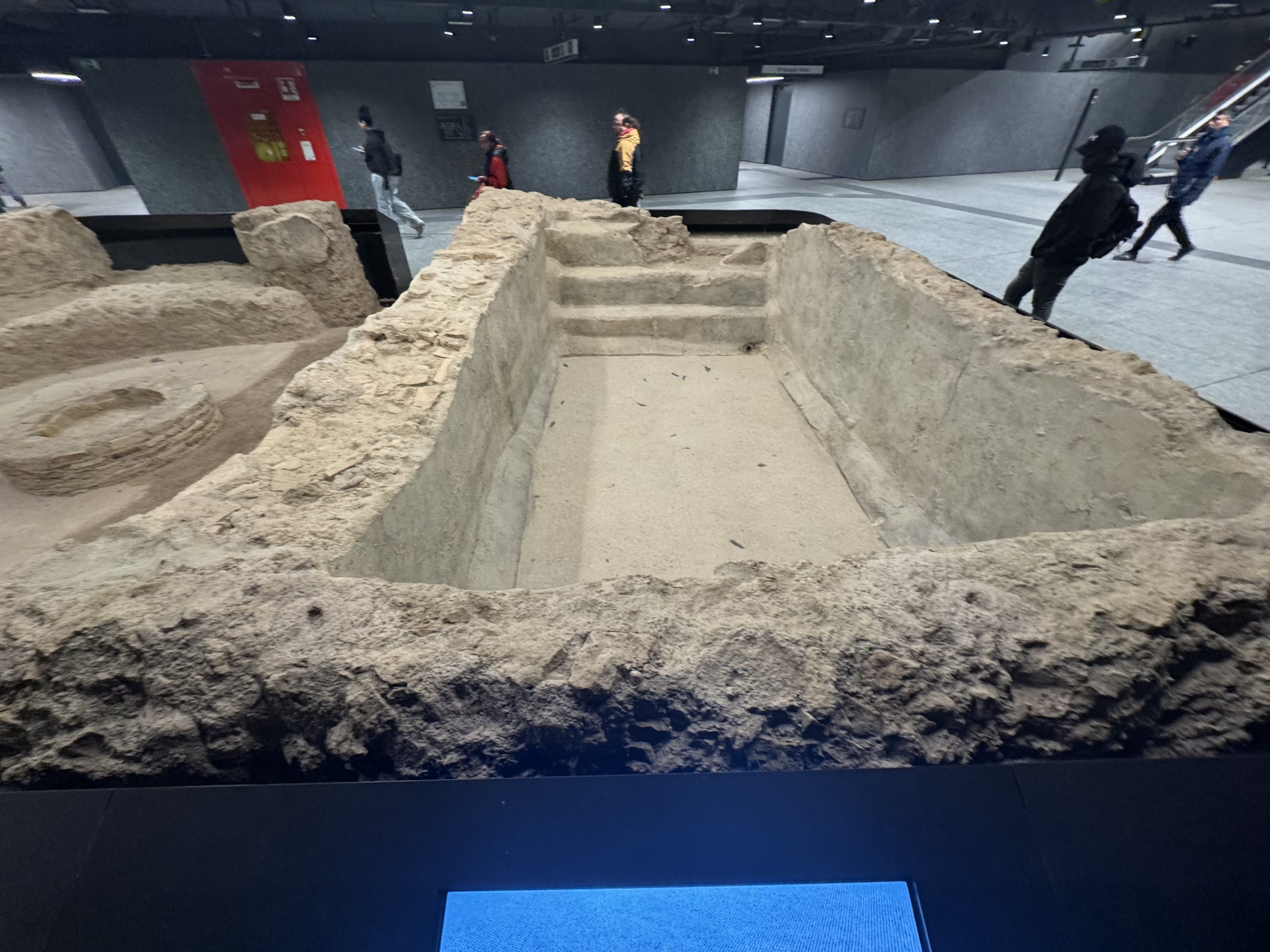 Ancient structural remains preserved inside a Metro Line C station.